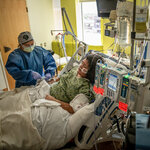 A nurse cares for Cerena Gonzales, 14, as she recovers in the Children’s Hospital of San Antonio on Tuesday.